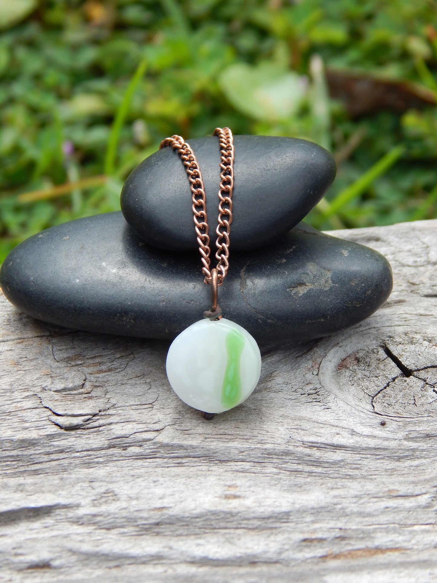 Small white and green glass pendant