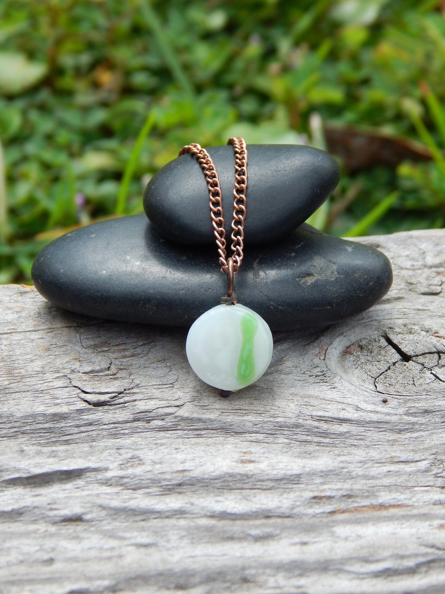 Small white and green glass pendant