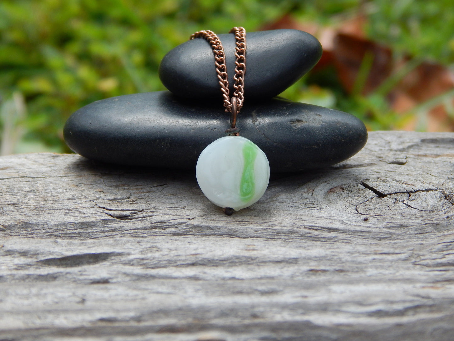 Small white and green glass pendant