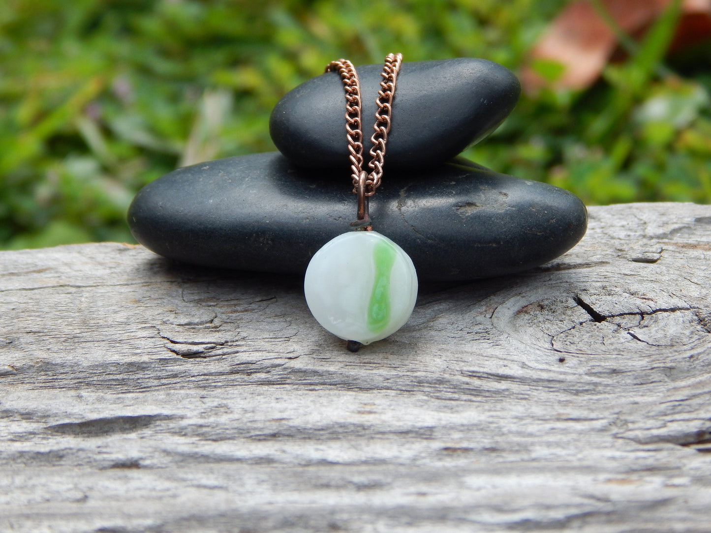 Small white and green glass pendant