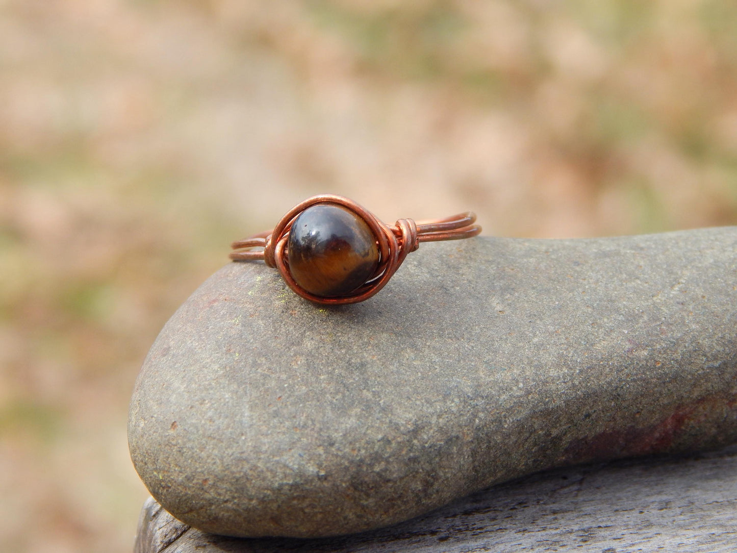 Copper wire wrapped size 12.5 tiger eye ring