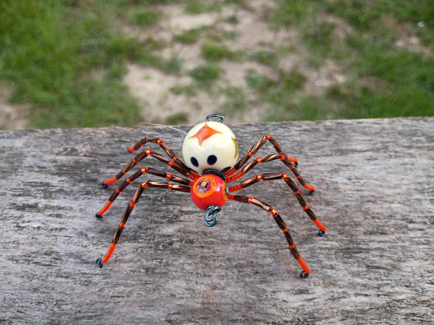 Orange beaded spider ornament