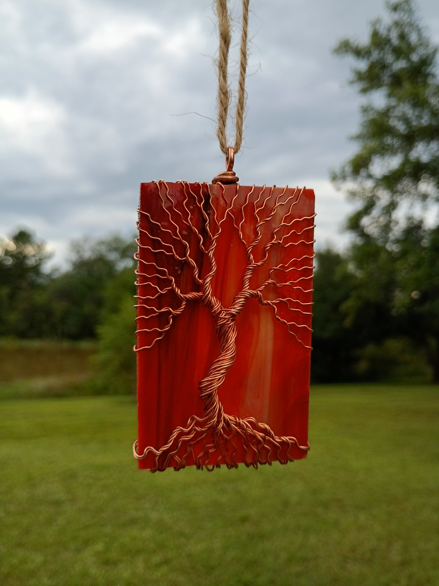 Orange glass tree of life suncatcher