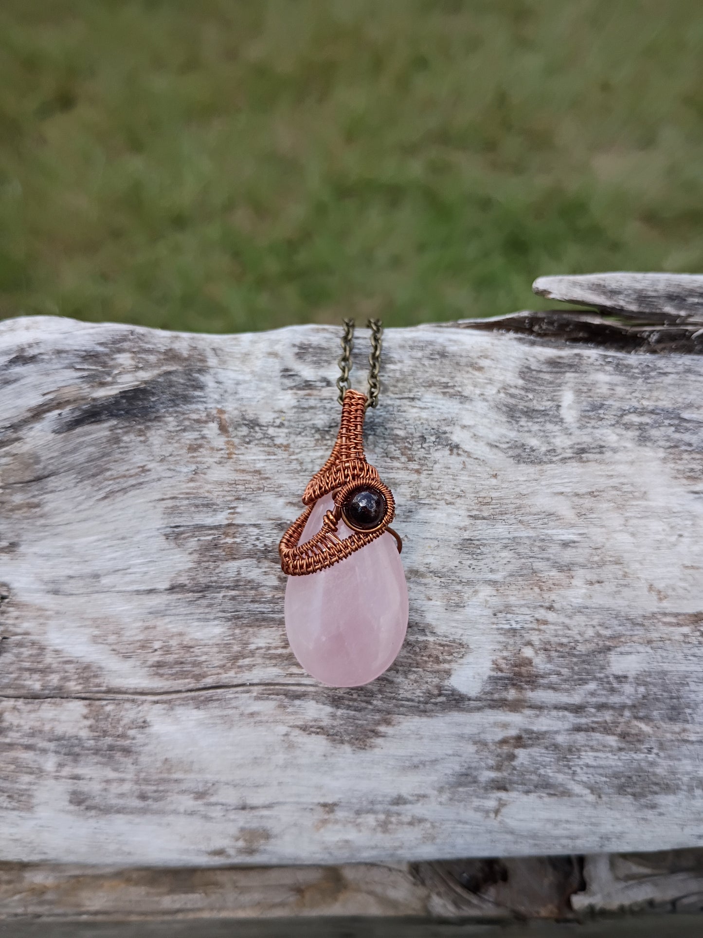 Rose quartz and garnet wire wrapped pendant