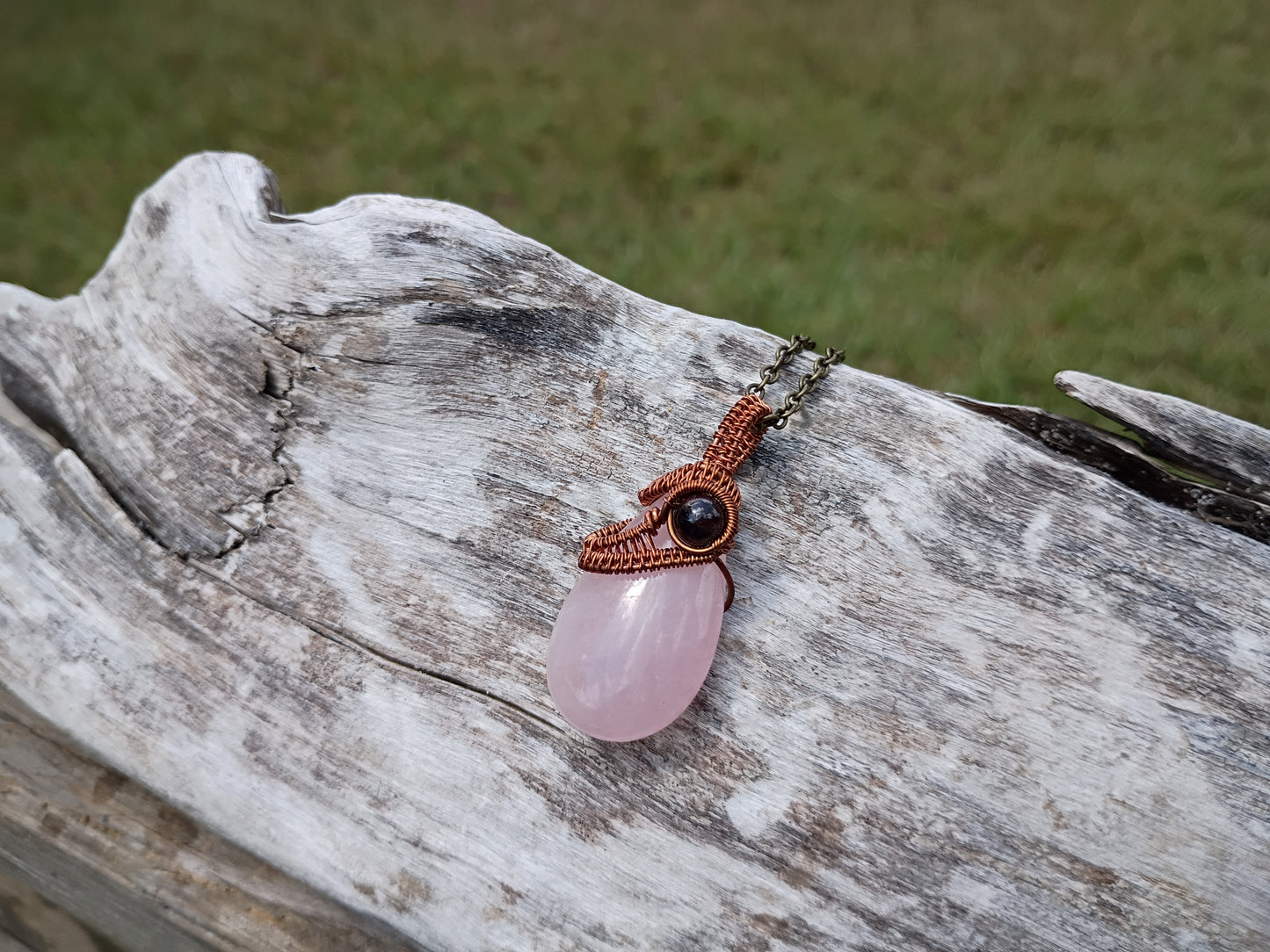 Rose quartz and garnet wire wrapped pendant