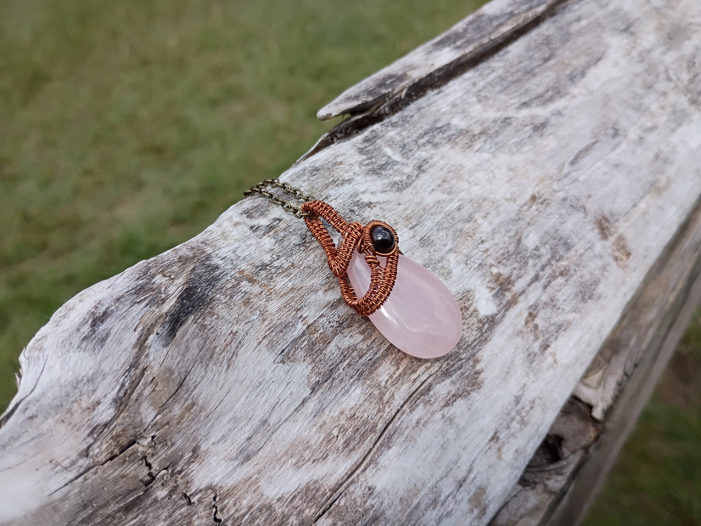 Rose quartz and garnet wire wrapped pendant