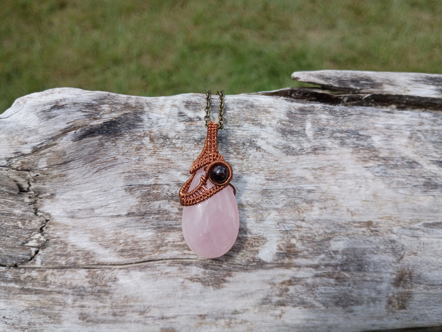 Rose quartz and garnet wire wrapped pendant