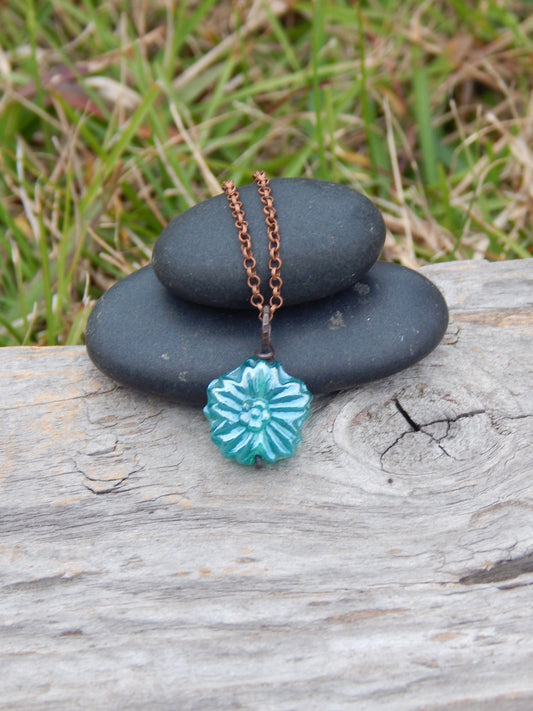 Dainty blue glass flower pendant