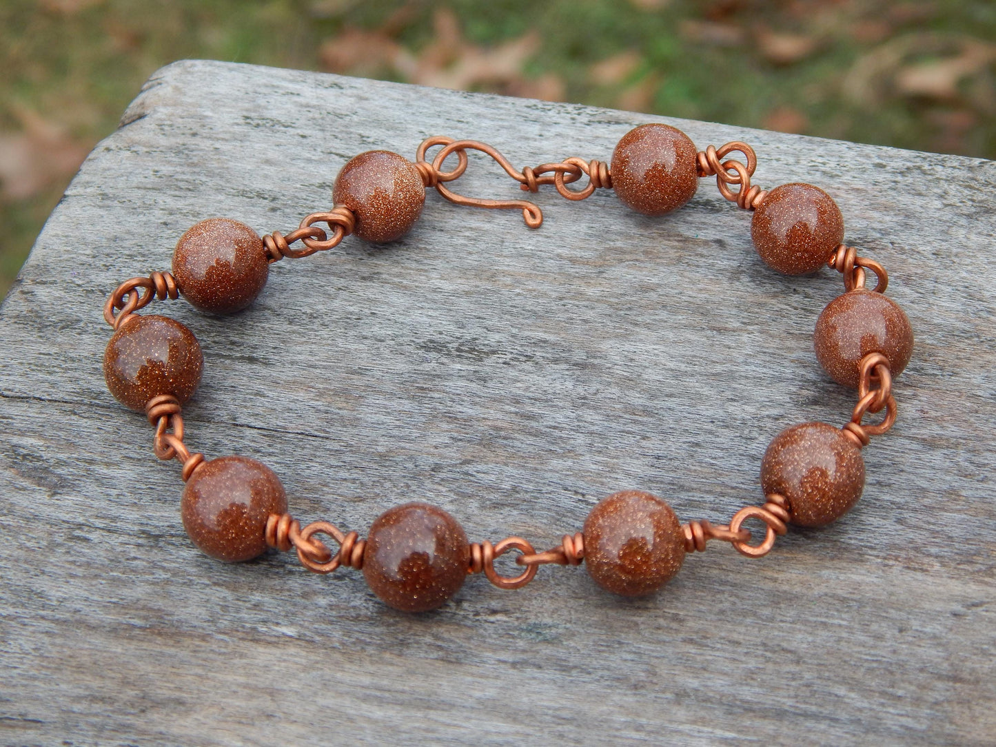 Goldstone 8 inch wire wrapped bracelet