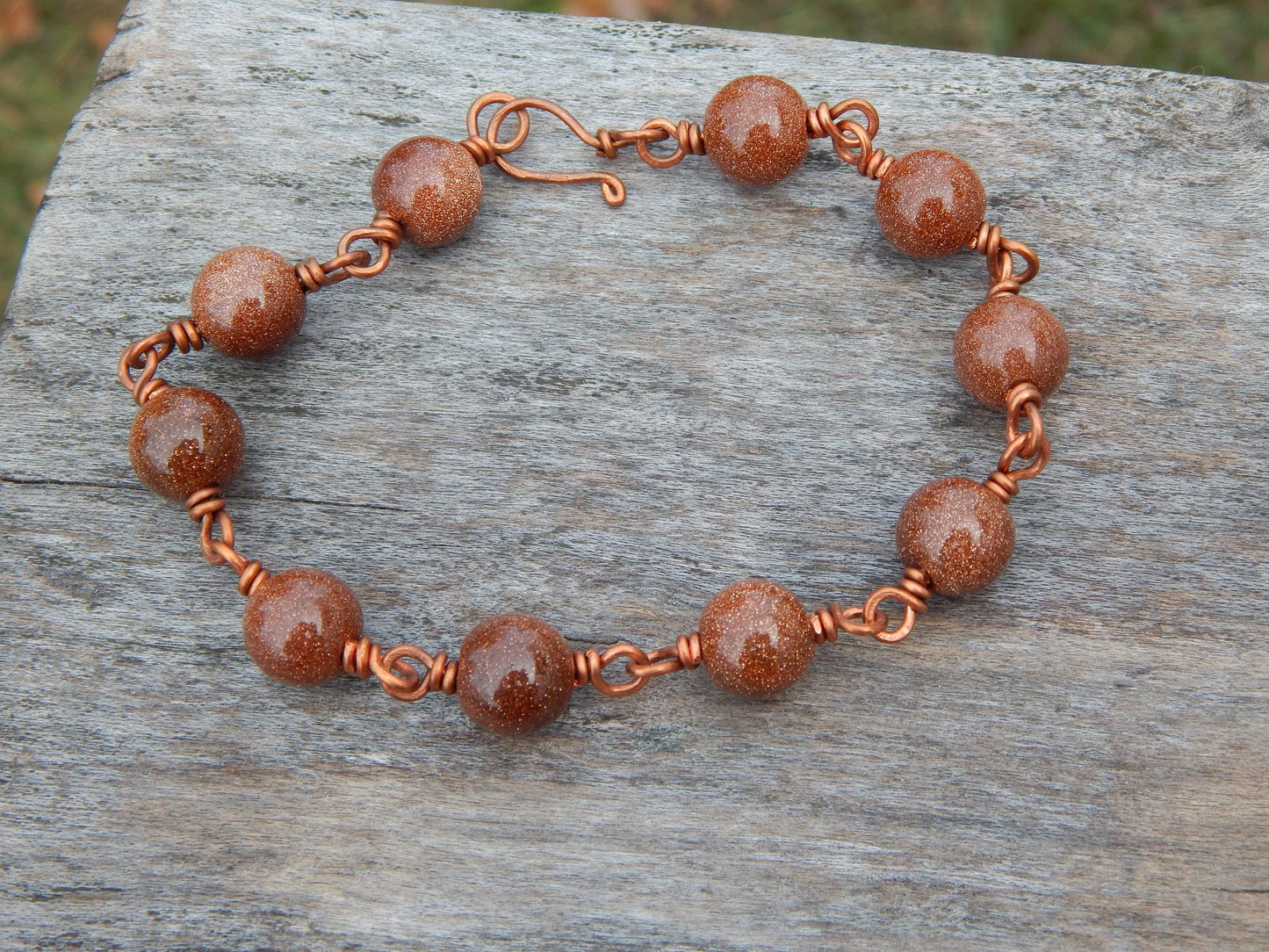 Goldstone 8 inch wire wrapped bracelet