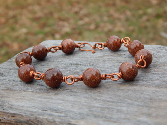 Goldstone 8 inch wire wrapped bracelet